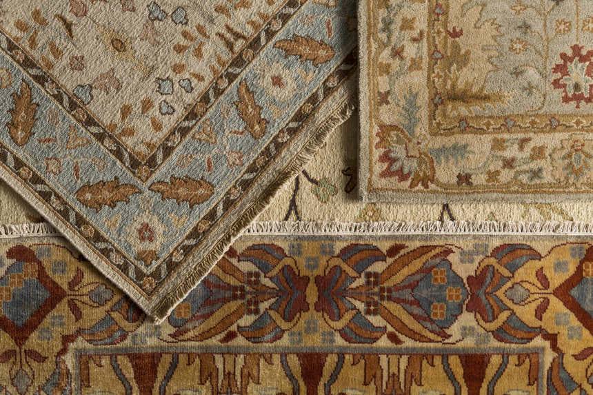 Close-up of the hand-knotted Brentford Carpet. Traditional rug design in oatmeal, brown, tan, olive, and black 100% wool. Styleshot