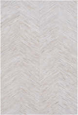 Close-up of the Upland Premium Rug. Brown, cream, and gray hair on hide forms a contemporary chevron pattern. Design-Rectangle-58