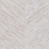 Close-up of the Upland Premium Rug. Hand-crafted hair on hide rug in a herringbone pattern with brown, cream, and gray tones. Swatch