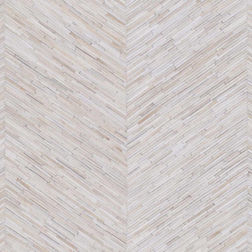 Close-up of the Upland Premium Rug. Hand-crafted hair on hide rug in a herringbone pattern with brown, cream, and gray tones. Swatch