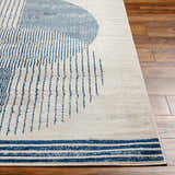 Close up of the Usra Area Rug, a contemporary rug in harbor blue and white geometric pattern. Front