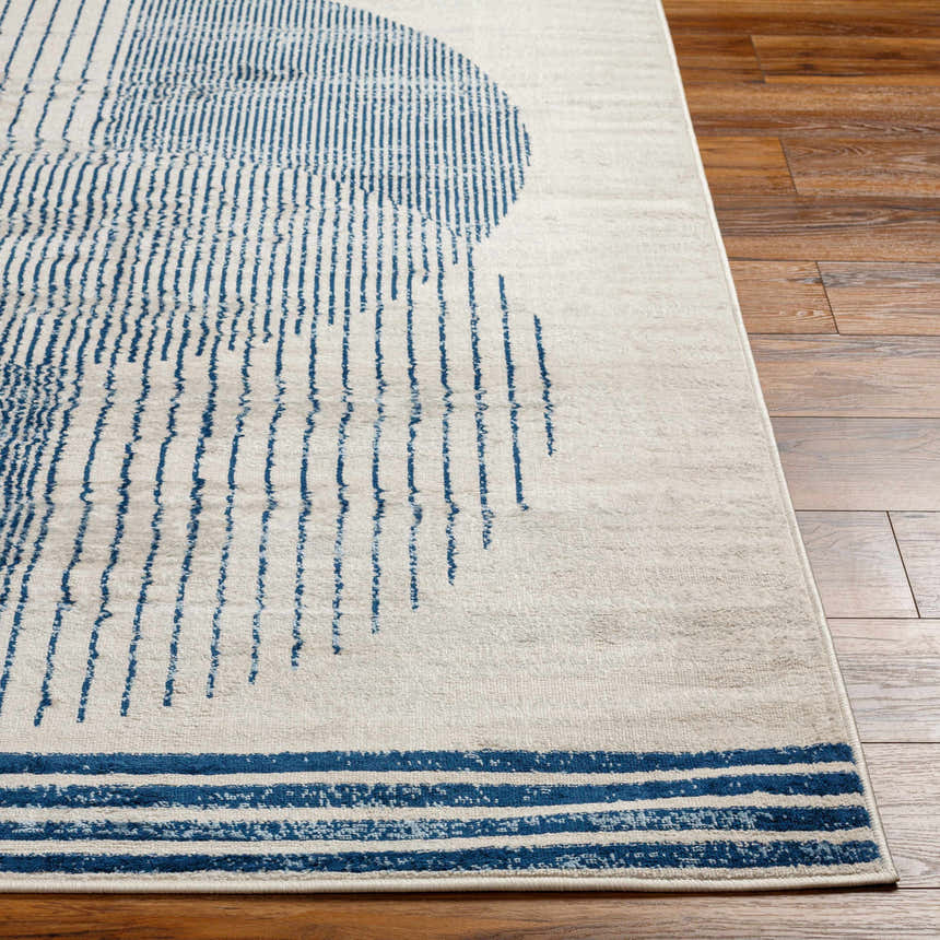 Close up of the Usra Area Rug, a contemporary rug in harbor blue and white geometric pattern. Front