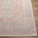 Close-up of the Vahn Area Rug showing its traditional pattern in dark blue, ivory, light pink, and red on a textured polyester weave. Front