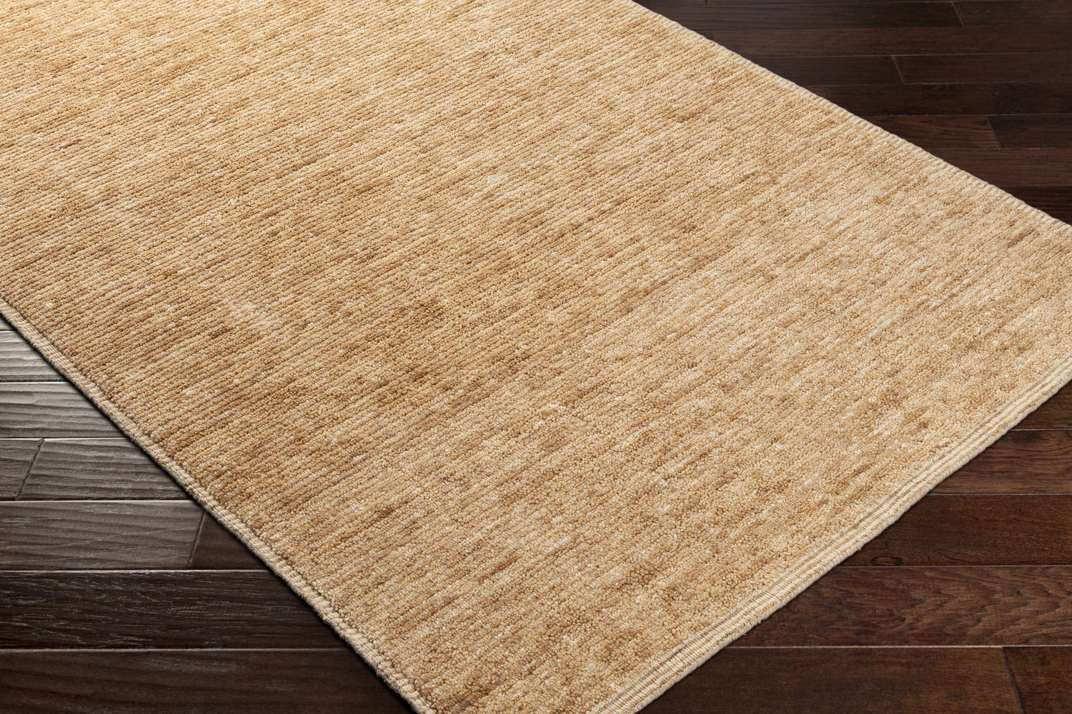 Close up of the hand-loomed Vezirhan Area Rug in peach and dark red, showcasing texture and construction. Corner