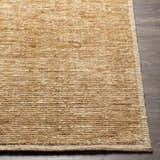 Close-up of the hand-loomed Vezirhan Area Rug. Dark red and peach cotton and wool blend with a subtle contemporary pattern. Front