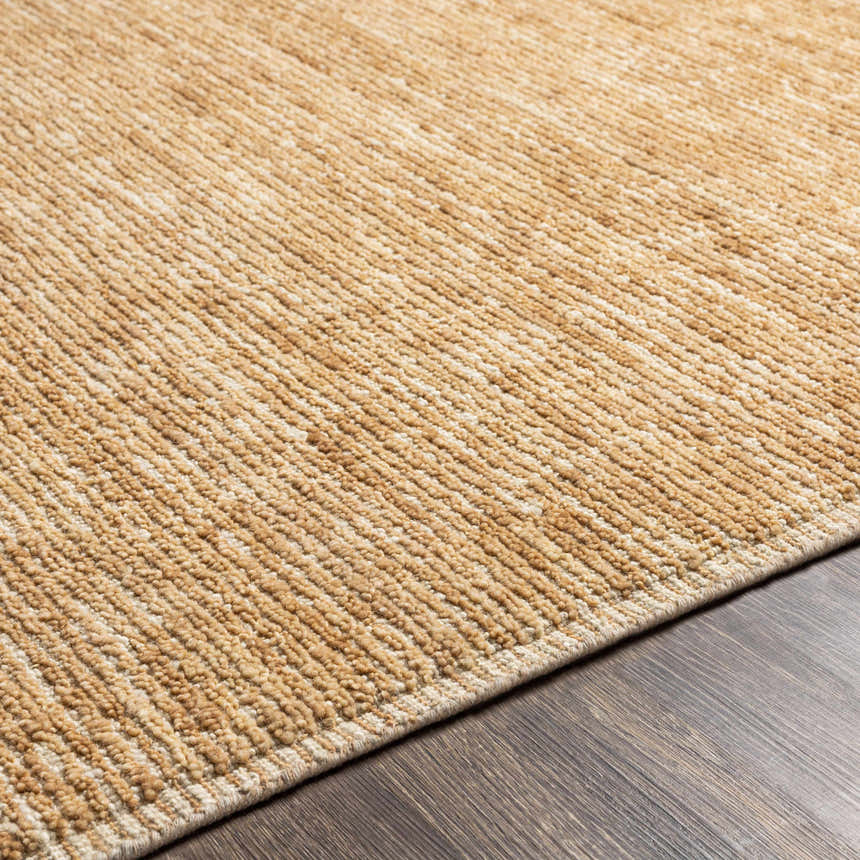 Close-up of the hand-loomed Vezirhan Area Rug, showcasing its peach and dark red cotton and wool texture. Texture