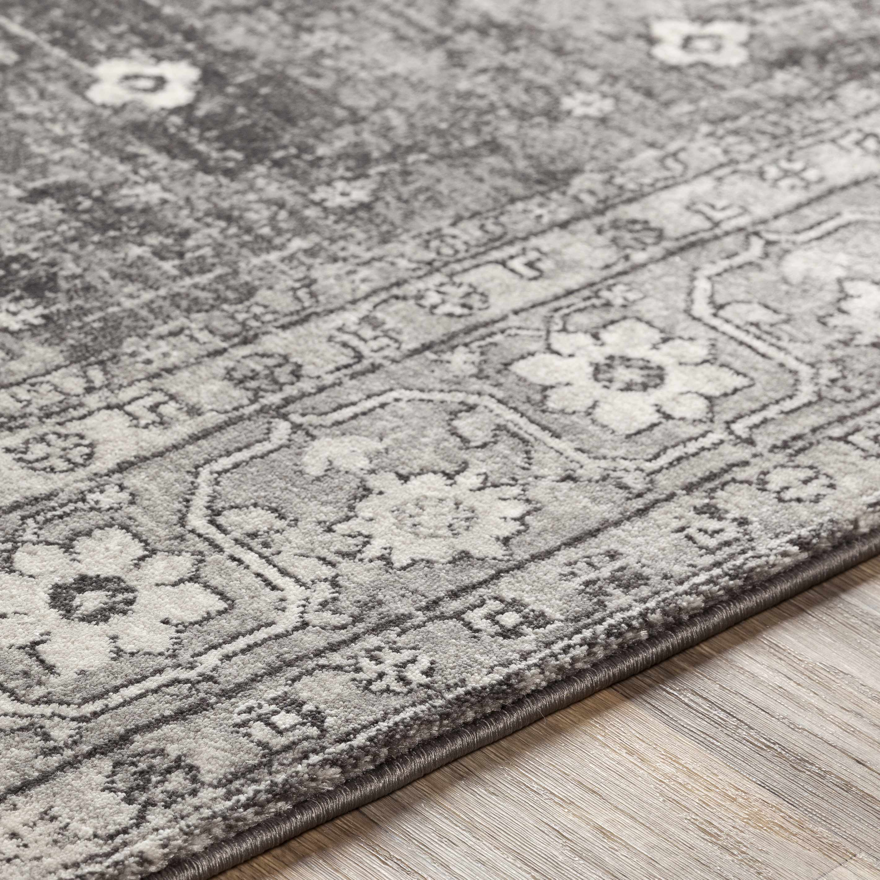 Close-up of the texture on Vancouver Area Rug - Clearance, showing fabric weave and feel. Traditional Area Rug Backing  