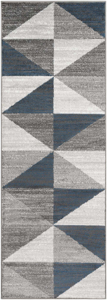 Close-up of the Volant Area Rug featuring a geometric triangle pattern in blue, charcoal, gray, and white. Design-Runner-2773