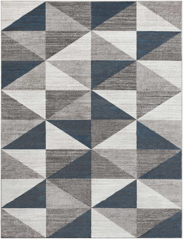 Close-up of the Volant Area Rug featuring a geometric triangle pattern in blue, charcoal, gray, and white. Design-Rectangle-710103