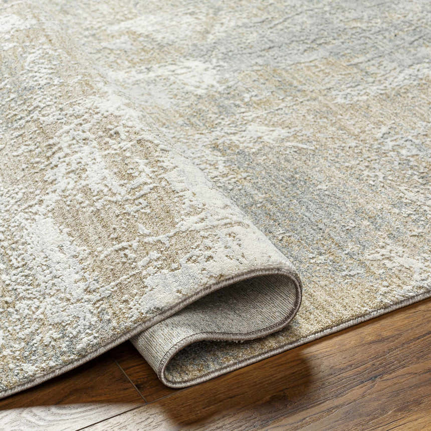 Close-up of the Owena Thick Luxe Boutique Rug showing its charcoal, cream, and light brown Southwestern-style pattern and texture. Fold