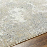 Close-up of the Owena Thick Luxe Boutique Rug. Abstract pattern in cream, light gray, light brown, and charcoal. Soft texture. Texture