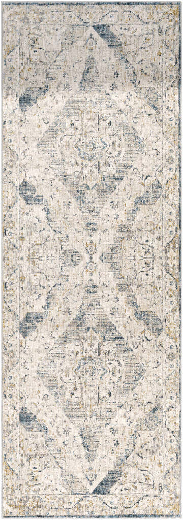 Close-up of the Wadeye Luxe Fringe Rug. Machine-woven polyester rug in dark blue, gray, light blue, and mustard. Bohemian style. Design-Runner-2773