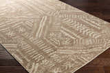 Close-up of the Wainfleet Jute Carpet showing its hand-knotted construction and farmhouse-style geometric pattern in beige and cream. Corner