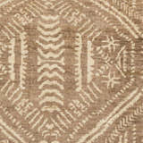 Close-up of the Wainfleet Jute Carpet showing its hand-knotted texture and farmhouse-style geometric pattern in brown and beige. Swatch