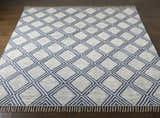 Close-up of the hand woven Walgett Carpet Area Rug. Features a blue diamond pattern on cream cotton. Front