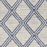 Close-up of the Walgett Carpet Area Rug. Hand-woven cotton rug with a blue diamond pattern on a cream background. Farmhouse style. Swatch