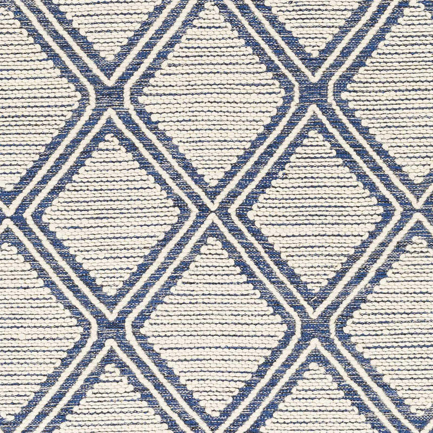 Close-up of the Walgett Carpet Area Rug. Hand-woven cotton rug with a blue diamond pattern on a cream background. Farmhouse style. Swatch