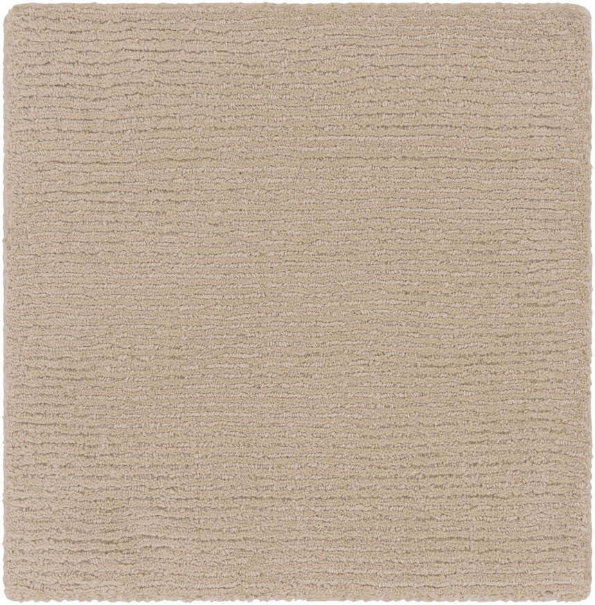 Close-up of the hand-loomed Brockton Solid Tan Area Rug. The wool rug has a subtle striped texture. Swatch