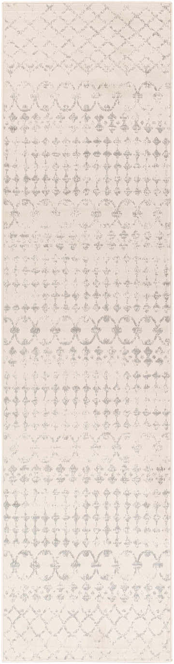 Close-up of the Warton Area Rug. Off-white rug with a light and medium gray bohemian-inspired pattern. Design-Runner-2710