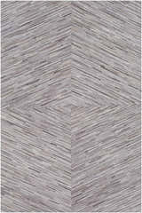 Close-up of the Wauzeka Premium Area Rug; brown, cream, and gray hair-on-hide strips create a chevron pattern. Design-Rectangle-58