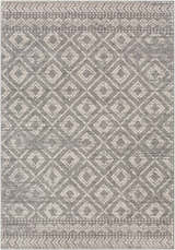 Close-up of the Webb Area Rug. Charcoal gray rug with a light slate and white diamond pattern. Bohemian style. Design-Rectangle-5373