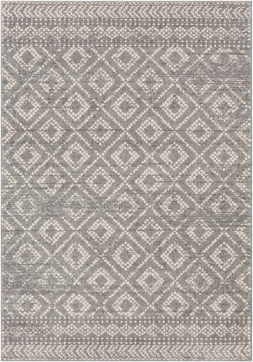 Close-up of the Webb Area Rug. Charcoal gray rug with a light slate and white diamond pattern. Bohemian style. Design-Rectangle-5373