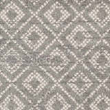 Close-up of the Webb Area Rug featuring a gray and white diamond pattern. Soft, textured weave. Swatch