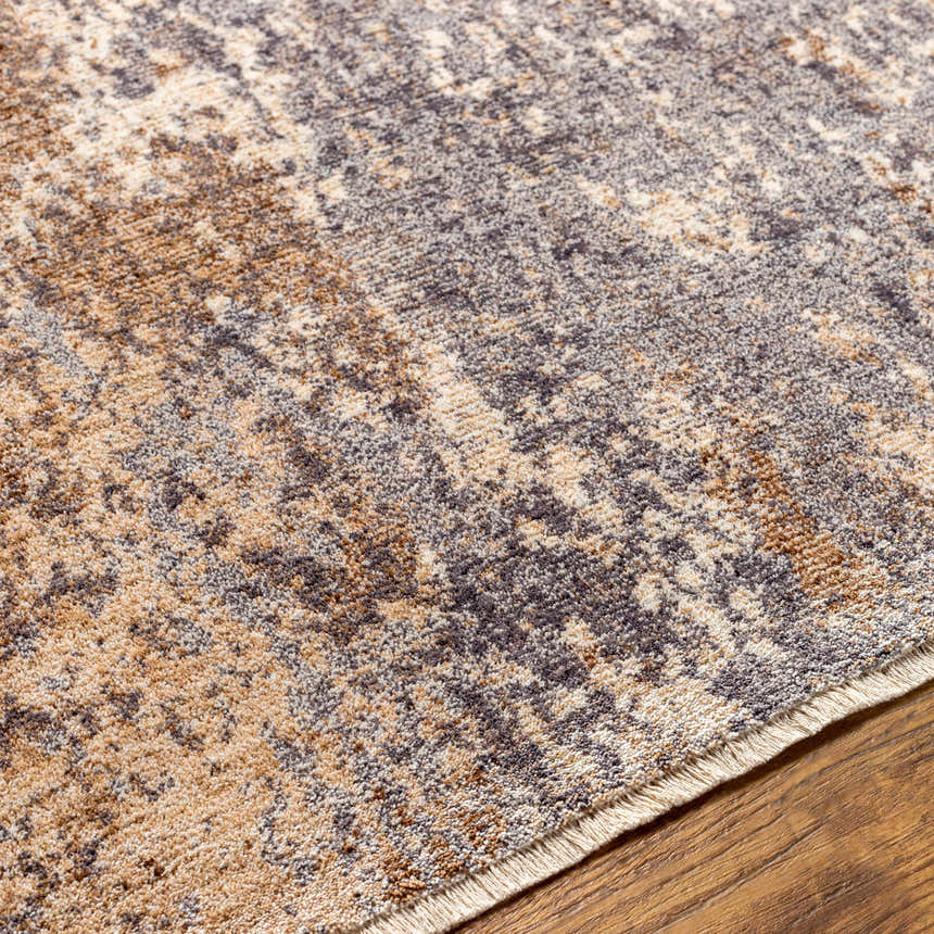 Close-up of Woodmoor Area Rug showing bone, dark gray, eggplant, walnut, and white thatch colors and soft texture. Texture