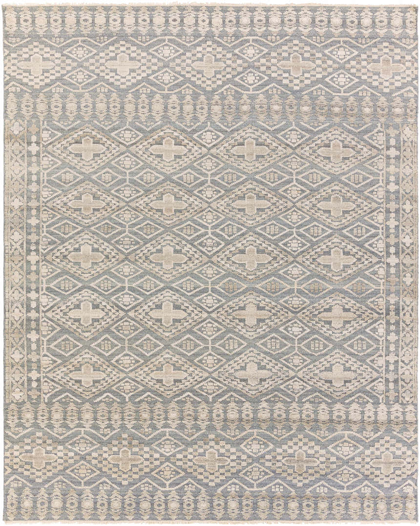 Close-up of the hand-knotted Woodsfield Premium Rug. Features a geometric diamond pattern in beige, brown, and gray wool. Design-Rectangle-810