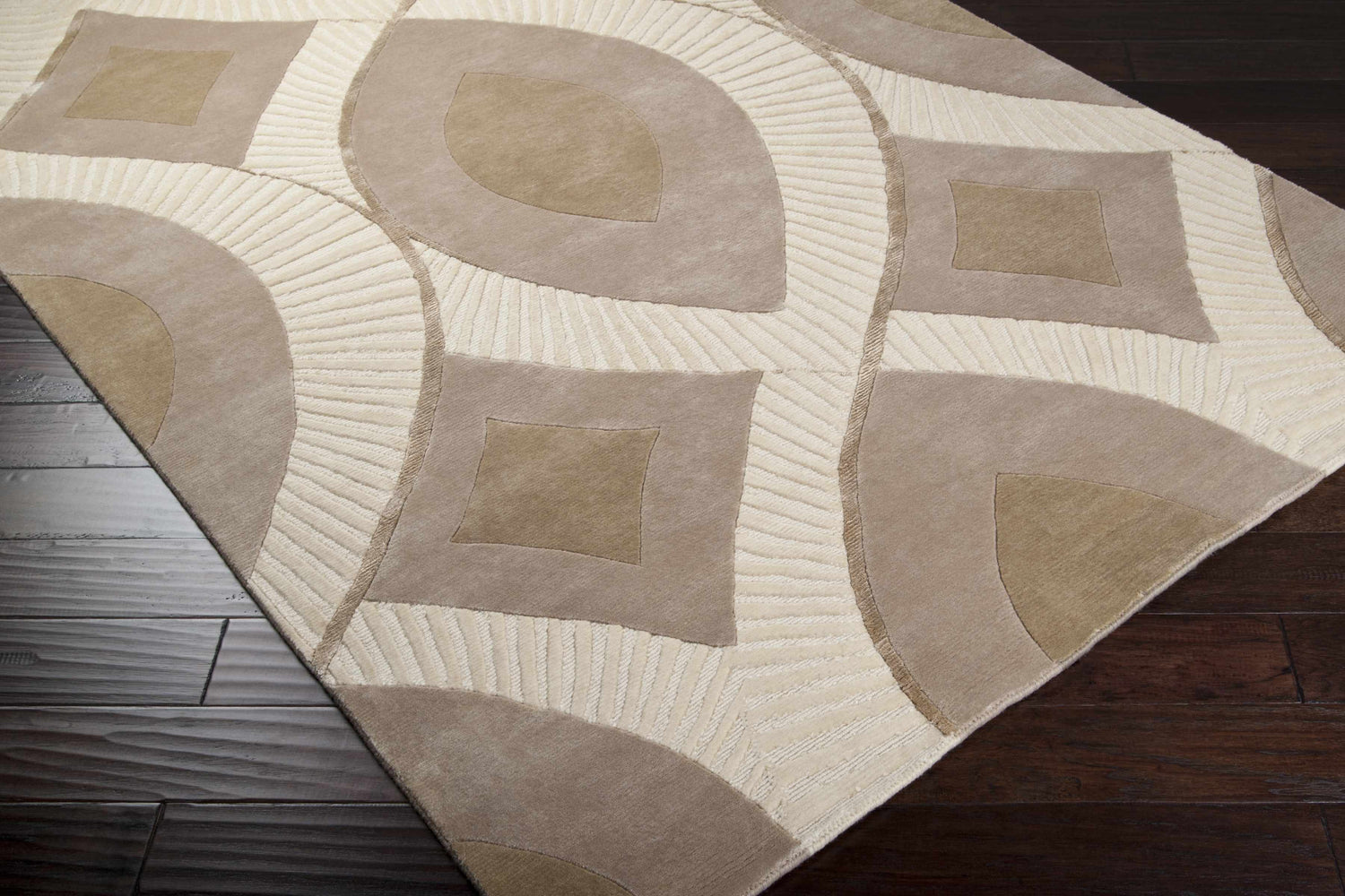 Close-up of the Weleetka Area Carpet, a hand-knotted wool rug with a contemporary geometric pattern in beige and cream. Corner