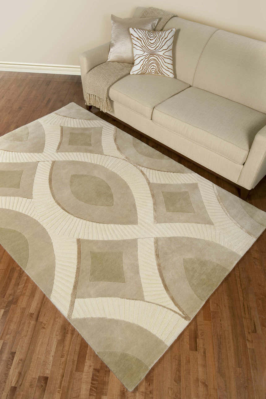 Living room scene with a beige sofa and the Weleetka Area Carpet, a wool rug with a geometric pattern in neutral tones. Roomscene-Rectangle