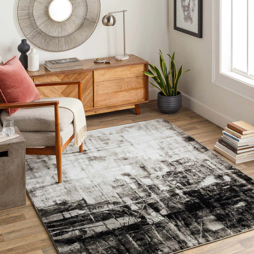 Living room scene with a black, charcoal, and off-white Westpoint Area Carpet, wood furniture, and modern decor. Roomscene-Rectangle