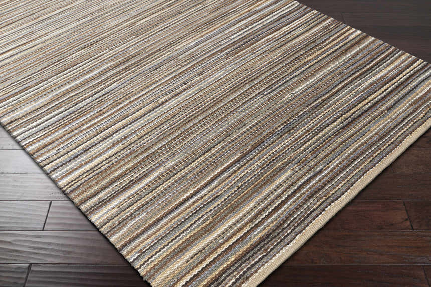 Close-up of Weymouth Jute Rug showing hand woven texture and striped pattern in cream, tan, teal, and black colors. Corner