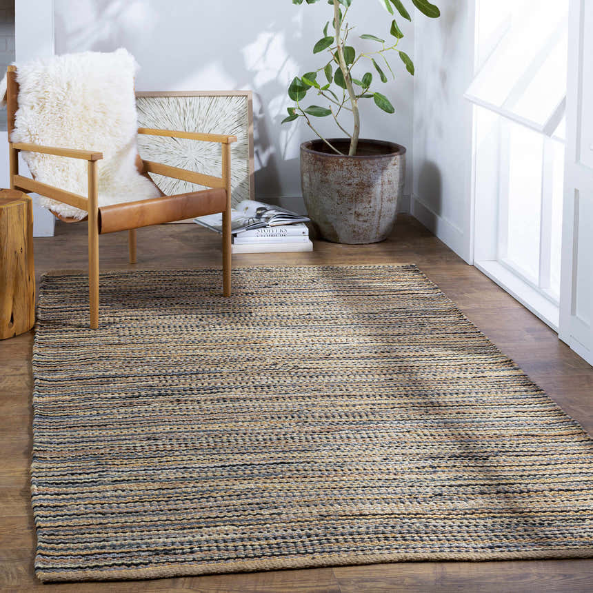 Farmhouse-style room with a Weymouth Jute Rug, wood chair with fur throw, and potted plant by a bright window. Roomscene-Rectangle