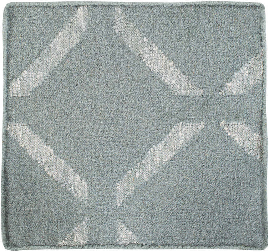 Close-up of the Weybridge Area Carpet. Light and medium gray hand woven rug with a geometric diamond pattern. Wool texture. Texture