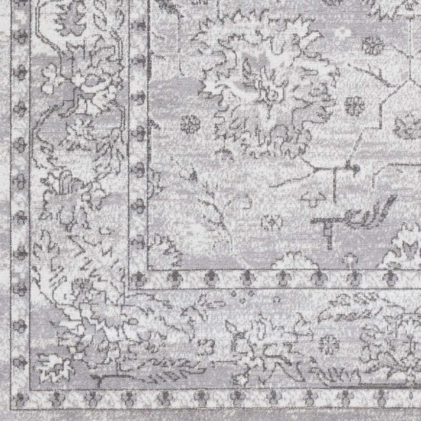 Close up of the Winstonville Clearance Rug featuring a gray and white traditional floral design. Swatch