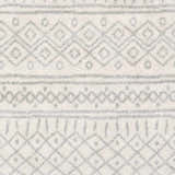 Close-up of the Winston Area Rug showing a cream base with medium gray geometric, bohemian-inspired patterns. Swatch