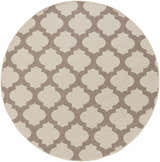 Close-up of the round Winterville Area Rug. Beige rug with a dark red quatrefoil pattern. Farmhouse style. Design-Round-73