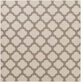Close-up of the Winterville Area Rug. Beige rug with a dark red quatrefoil pattern. Machine woven olefin rug. Design-Square-89