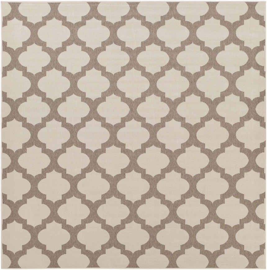 Close-up of the Winterville Area Rug. Beige rug with a dark red quatrefoil pattern. Machine woven olefin rug. Design-Square-89