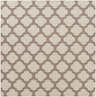 Close-up of the Winterville Area Rug. Beige rug with a dark red quatrefoil pattern. Machine woven olefin rug. Design-Square-89