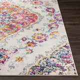 Close-up of the Wallsburg Magenta & Cream Area Rug. Features a bohemian floral pattern with cream, magenta, yellow, and blue accents. Front