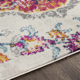 Close-up of the Wallsburg Magenta & Cream Area Rug showing its floral pattern with magenta, cream, yellow, and blue colors. Texture