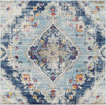 Close-up of the Wallsburg Blue Area Rug, a machine-woven rug with burnt orange, fuchsia, and navy floral accents. Design-Square-67