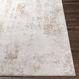Close-up of the textured Windale Luxe Area Rug. Off-white rug with brown, gray, and mustard accents. Contemporary style. Front