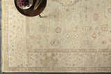 Close-up of the hand-knotted Wooroloo Area Rug. Beige, dusty pink, and gray tones with a traditional oriental pattern. Styleshot