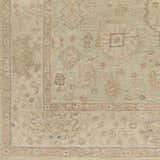 Close-up of the hand-knotted Wooroloo Area Rug. Beige, tan, and dusty pink oriental rug with a traditional pattern. Swatch