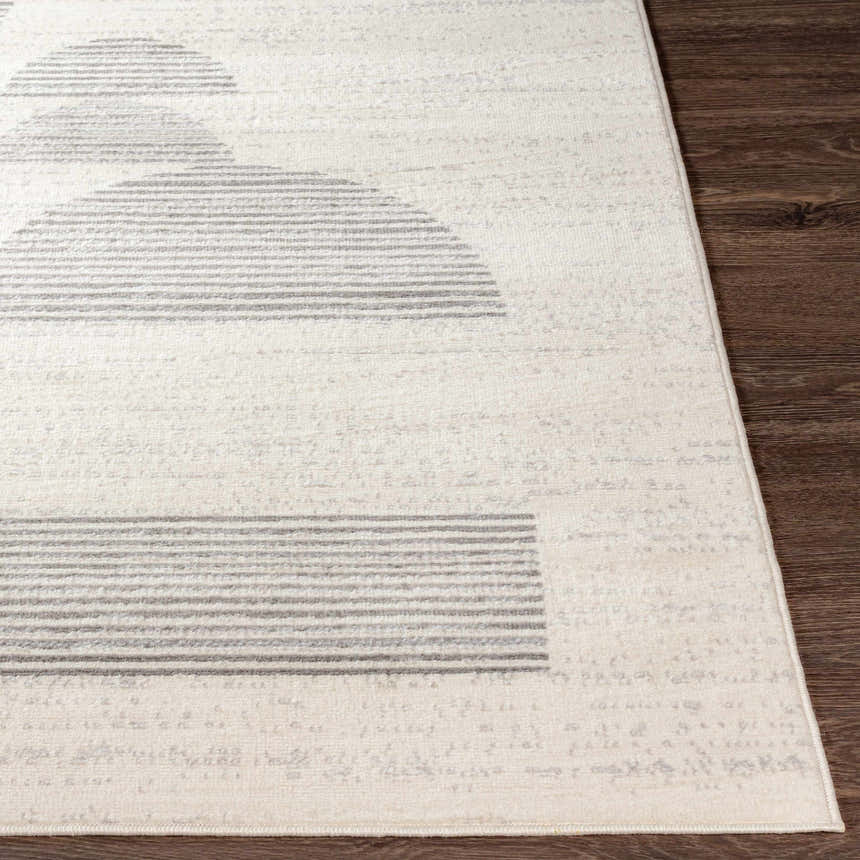 Close-up of the Westcourt Area Rug showing a geometric pattern with gray stripes on a cream background. Front