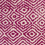 Close-up of Westhill Area Carpet. Hand-knotted wool rug with a fuchsia diamond pattern on a light beige background. Swatch