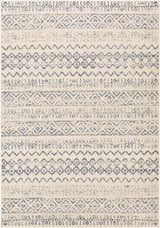 Close-up of the Westborough Beige Area Rug. Contemporary style with blue geometric patterns on a cream background. Design-Rectangle-5373